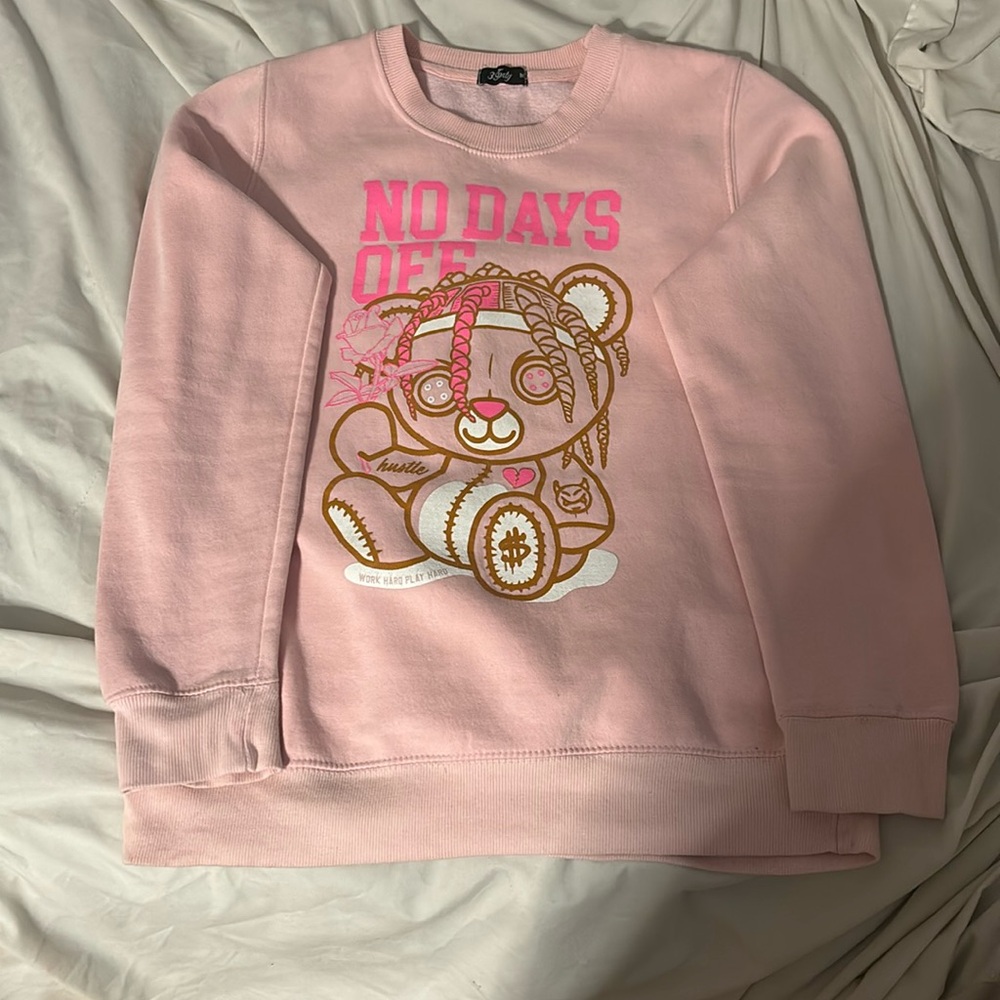 Hi, I am selling a cute light pink teddy bear sweater.